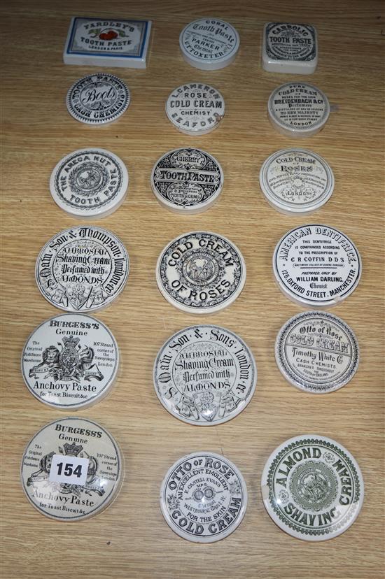 A collection of eighteen mainly black printed tooth,anchovy and other paste pot lids, including Yardley